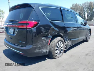 2021 Chrysler Pacifica Hybrid Touring L with VIN 2C4RC1L71MR599631, listed as a IAAI auction lot 42151965 with 67,401 mi miles and . Bid and sale history available at DreamBid. Image 6.