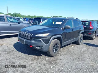 2016 Jeep Cherokee Trailhawk z VIN 1C4PJMBS6GW162742, wystawiony jako IAAI lot #42383200 z przebiegiem 124 791 mil mil oraz . Historia ofert i sprzedaży dostępna na DreamBid. Obrazek 2.