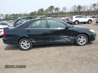 2004 Toyota Camry LE with VIN 4T1BF32KX4U077010, listed as a IAAI auction lot 42039297 with 113,742 mi miles. Bid and sale history available at carsss.com. Image 6.