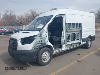2020 Ford Transit Cargo with VIN 1FTBR2CG1LKB43034, listed as a IAAI auction lot 41668193 with 56,827 mi miles and . Bid and sale history available at DreamBid. Image 17.