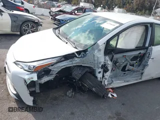 2021 Toyota Prius L Eco with VIN JTDKAMFUXM3144845, listed as a IAAI auction lot 41358306 with Not provided miles and . Bid and sale history available at DreamBid. Image 6.