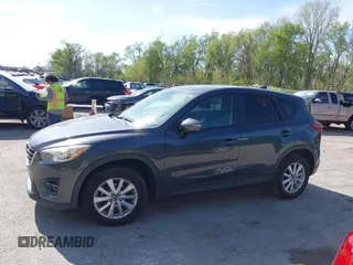 2016 Mazda CX-5 Touring z VIN JM3KE2CY4G0708972, wystawiony jako IAAI lot #42043013 z przebiegiem 157 573 mil mil oraz . Historia ofert i sprzedaży dostępna na DreamBid. Obrazek 14.
