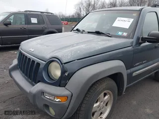 2002 Jeep Liberty Sport with VIN 1J8GL48K62W298212, listed as a IAAI auction lot 41918130 with 226,299 mi miles. Bid and sale history available at carsss.com. Image 6.