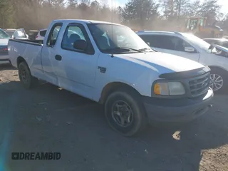 2003 Ford F-150 XL with VIN 1FTRX17W33NA66469, listed as a IAAI auction lot 41677909 with 236,619 mi miles. Bid and sale history available at carsss.com. Image 1.