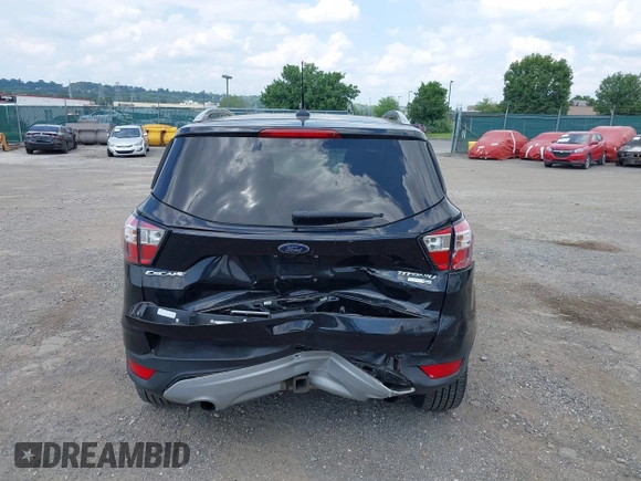 2018 Ford Escape Titanium z VIN 1FMCU9J9XJUB66275, wystawiony jako IAAI lot #42757952 z przebiegiem 97 629 mil mil oraz . Historia ofert i sprzedaży dostępna na DreamBid. Obrazek 6.