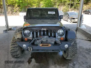 2011 Jeep Wrangler Unlimited Sport with VIN 1J4HA3H19BL574932, listed as a Copart auction lot 53250465 with 113,344 mi miles and Salvage Title. Bid and sale history available at carsss.com. Image 5.