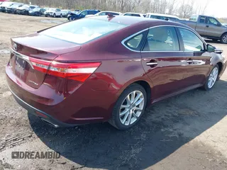 2014 Toyota Avalon Limited with VIN 4T1BK1EB1EU134577, listed as a IAAI auction lot 41994918 with 74,570 mi miles. Bid and sale history available at carsss.com. Image 4.