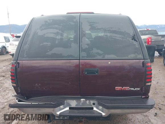 1997 GMC Yukon with VIN 1GKEK13R0VJ755574, listed as a IAAI auction lot 41158932 with 212,668 mi miles. Bid and sale history available at carsss.com. Image 17.