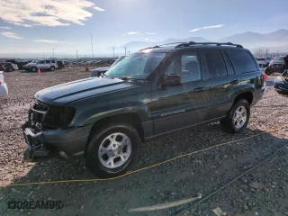 2001 Jeep Grand Cherokee Laredo with VIN 1J4GW48N21C570404, listed as a Copart auction lot 85996954 with 153,838 mi miles and Salvage Title. Bid and sale history available at carsss.com. Image 1.