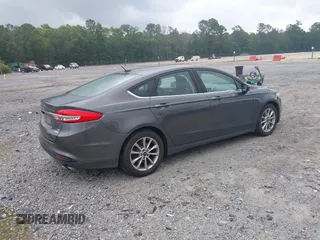 2017 Ford Fusion SE z VIN 3FA6P0HD6HR174945, wystawiony jako IAAI lot #42416548 z przebiegiem 128 410 mil mil oraz . Historia ofert i sprzedaży dostępna na DreamBid. Obrazek 4.