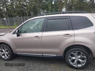 2015 Subaru Forester Touring with VIN JF2SJAUC1FH457069, listed as a IAAI auction lot 42293542 with 71,689 mi miles and . Bid and sale history available at DreamBid. Image 14.
