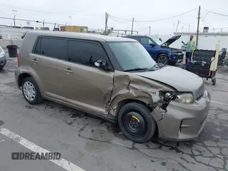 2015 Scion xB z VIN JTLZE4FE8FJ076253, wystawiony jako IAAI lot #42400949 z przebiegiem 119 751 mil mil oraz . Historia ofert i sprzedaży dostępna na DreamBid. Obrazek 1.