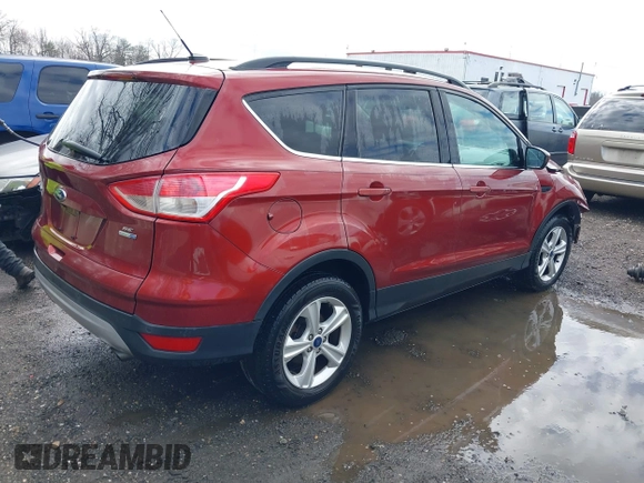 2016 Ford Escape SE with VIN 1FMCU9GXXGUB02932, listed as a IAAI auction lot 41797351 with 74,284 mi miles. Bid and sale history available at carsss.com. Image 4.