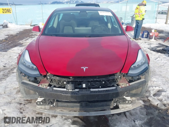 2018 Tesla Model 3 Long Range Battery with VIN 5YJ3E1EB0JF064041, listed as a IAAI auction lot 41562239 with 54,720 mi miles and . Bid and sale history available at DreamBid. Image 13.