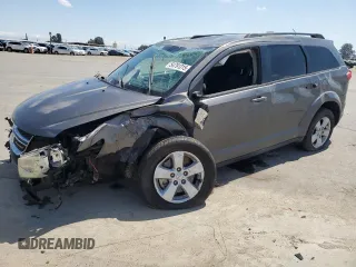 2013 Dodge Journey SE with VIN 3C4PDCAB9DT656887, listed as a Copart auction lot 54791315 with 130,394 mi miles and Salvage title. Bid and sale history available at DreamBid. Image 1.