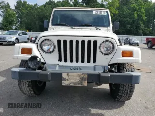 1999 Jeep Wrangler Sahara z VIN 1J4FY49S0XP432968, wystawiony jako Copart lot #65033715 z przebiegiem 126 420 mil mil oraz Szkoda całkowita • Salvage title. Historia ofert i sprzedaży dostępna na DreamBid. Obrazek 5.