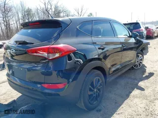 2018 Hyundai Tucson SE with VIN KM8J23A45JU603646, listed as a IAAI auction lot 41838097 with 64,704 mi miles. Bid and sale history available at carsss.com. Image 4.