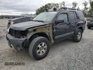 2014 Nissan Xterra Pro-4X with VIN 5N1AN0NW9EN805018, listed as a Copart auction lot 66021575 with 74,770 mi miles and Salvage title. Bid and sale history available at DreamBid. Image 1.