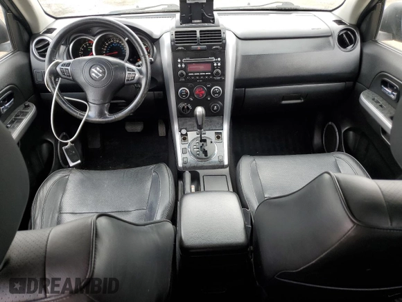 2012 Suzuki Grand Vitara Limited with VIN JS3TD0D74C4100125, listed as a Copart auction lot 58935355 with 218,085 mi miles and Salvage title. Bid and sale history available at DreamBid. Image 8.