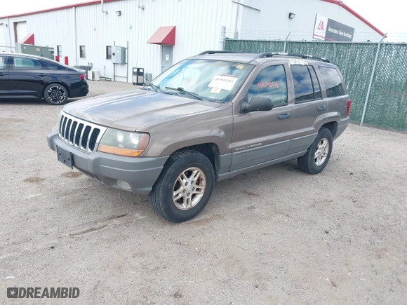 2002 Jeep Grand Cherokee Laredo with VIN 1J4GW48S32C123720, listed as a IAAI auction lot 41909204 with 157,996 mi miles. Bid and sale history available at carsss.com. Image 2.