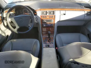 1999 Mercedes-Benz E-Class with VIN WDBJF82H1XX024280, listed as a Copart auction lot 83213204 with 212,712 mi miles and Salvage Title. Bid and sale history available at carsss.com. Image 8.