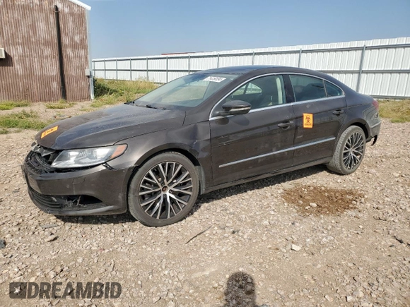 2014 Volkswagen CC VR6 Executive 4Motion with VIN WVWGU7AN9EE523145, listed as a Copart auction lot 71419134 with 94,547 mi miles and Salvage Title. Bid and sale history available at carsss.com. Image 1.