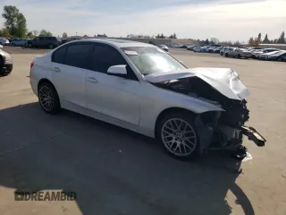2012 BMW 3 Series 328i with VIN WBA3C1C5XCA696847, listed as a Copart auction lot 53005425 with 143,725 mi miles and Salvage title. Bid and sale history available at DreamBid. Image 4.