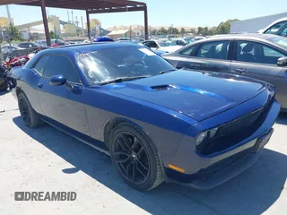2013 Dodge Challenger R/T z VIN 2C3CDYBT9DH565280, wystawiony jako IAAI lot #42315527 z przebiegiem 128 638 mil mil oraz . Historia ofert i sprzedaży dostępna na DreamBid. Obrazek 1.