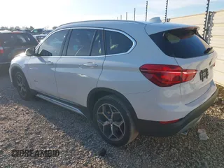 2018 BMW X1 sDrive28i with VIN WBXHU7C36J5H41267, listed as a IAAI auction lot 41270207 with 84,726 mi miles. Bid and sale history available at carsss.com. Image 3.