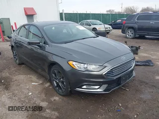 2018 Ford Fusion SE z VIN 3FA6P0H75JR109925, wystawiony jako IAAI lot #38419455 z przebiegiem 123 015 mil mil oraz . Historia ofert i sprzedaży dostępna na DreamBid. Obrazek 1.