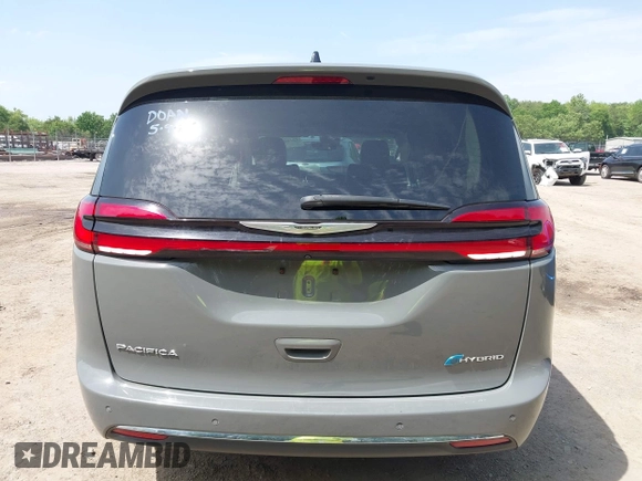 2023 Chrysler Pacifica Hybrid Touring L with VIN 2C4RC1L73PR522988, listed as a IAAI auction lot 42280263 with 54,939 mi miles and . Bid and sale history available at DreamBid. Image 16.