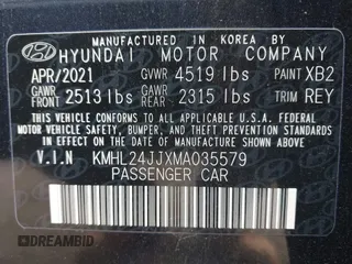 2021 Hyundai Sonata Hybrid Blue with VIN KMHL24JJXMA035579, listed as a IAAI auction lot 41688249 with 31,726 mi miles. Bid and sale history available at carsss.com. Image 9.