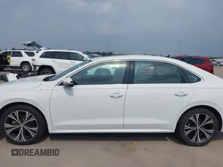 2021 Volkswagen Passat SE z VIN 1VWSA7A32MC014376, wystawiony jako IAAI lot #42314372 z przebiegiem 81 209 mil mil oraz . Historia ofert i sprzedaży dostępna na DreamBid. Obrazek 14.