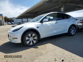 2023 Tesla Model Y Long Range z VIN 7SAYGDEE4PF687251, wystawiony jako Copart lot #52628355 z przebiegiem 46 571 mil mil oraz Szkoda całkowita • Salvage title. Historia ofert i sprzedaży dostępna na DreamBid. Obrazek 1.