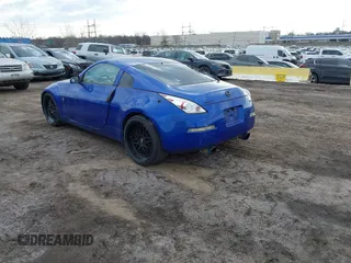 2004 Nissan 350Z Touring with VIN JN1AZ34E04T052916, listed as a IAAI auction lot 41450917 with 157,699 mi miles. Bid and sale history available at carsss.com. Image 3.
