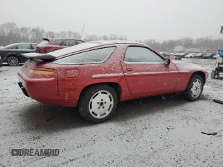 1987 Porsche 928 z VIN WP0JB0926HS860519, wystawiony jako Copart lot #84757504 z przebiegiem 64 737 mil mil oraz Szkody całkowita. Historia ofert i sprzedaży dostępna na DreamBid. Obrazek 3.