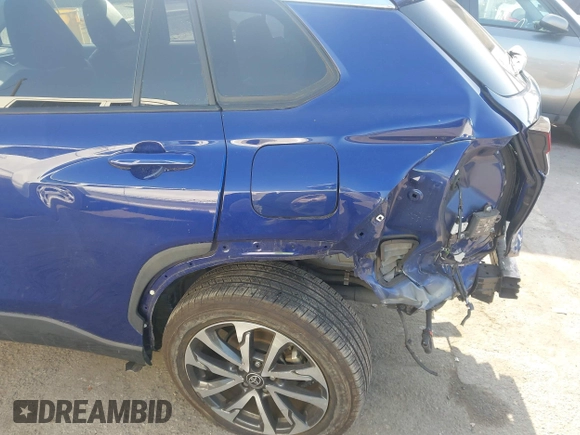 2022 Toyota Corolla Cross XLE with VIN 7MUDAAAG7NV024323, listed as a IAAI auction lot 42643048 with 76,465 mi miles and . Bid and sale history available at DreamBid. Image 6.