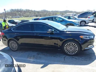 2017 Ford Fusion SE z VIN 3FA6P0HD1HR138693, wystawiony jako IAAI lot #41837634 z przebiegiem 117 638 mil mil oraz . Historia ofert i sprzedaży dostępna na DreamBid. Obrazek 13.