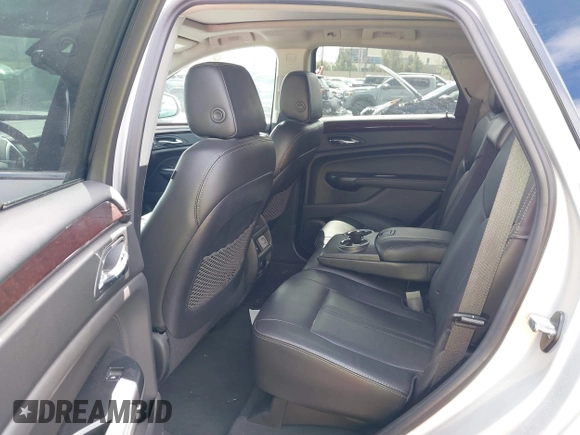 2016 Cadillac SRX Luxury Collection z VIN 3GYFNBE38GS520891, wystawiony jako IAAI lot #41781445 z przebiegiem 52 202 mil mil oraz . Historia ofert i sprzedaży dostępna na DreamBid. Obrazek 8.