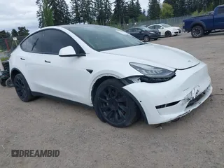 2021 Tesla Model Y Standard Range with VIN 5YJYGDED9MF121828, listed as a IAAI auction lot 42119518 with 34,454 mi miles. Bid and sale history available at carsss.com. Image 1.
