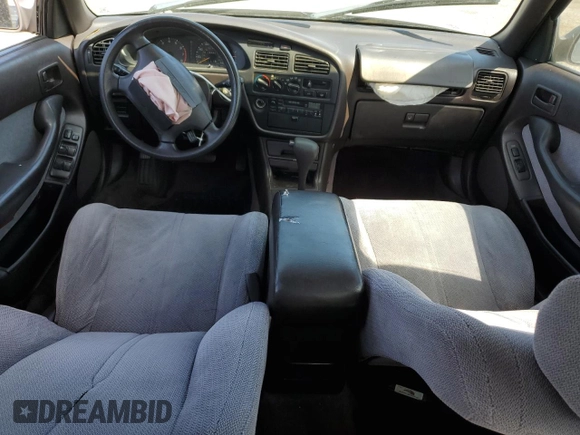 1994 Toyota Camry LE z VIN JT2GK12E6R0055565, wystawiony jako Copart lot #54031255 z przebiegiem 240 841 mil mil oraz Szkoda całkowita • Salvage title. Historia ofert i sprzedaży dostępna na DreamBid. Obrazek 8.