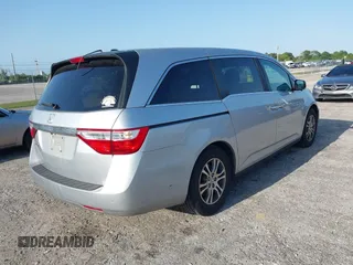 2013 Honda Odyssey EX-L with VIN 5FNRL5H67DB008575, listed as a IAAI auction lot 42008315 with 131,984 mi miles and . Bid and sale history available at carsss.com. Image 4.