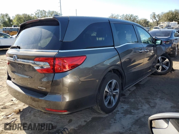 2020 Honda Odyssey Touring with VIN 5FNRL6H84LB012640, listed as a Copart auction lot 80430814 with 58,313 mi miles and Salvage Title. Bid and sale history available at DreamBid. Image 3.