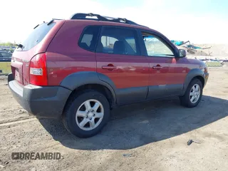 2005 Hyundai Tucson GLS with VIN KM8JN12D35U180615, listed as a IAAI auction lot 42104729 with 128,123 mi miles. Bid and sale history available at carsss.com. Image 4.