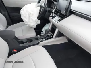 2022 Toyota Corolla Cross LE with VIN 7MUCAABG8NV004527, listed as a IAAI auction lot 42259519 with 15,211 mi miles and . Bid and sale history available at DreamBid. Image 5.