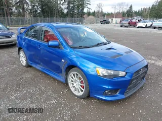 2015 Mitsubishi Lancer Evolution GSR with VIN JA32W8FV4FU012578, listed as a IAAI auction lot 41730742 with 64,762 mi miles. Bid and sale history available at carsss.com. Image 1.