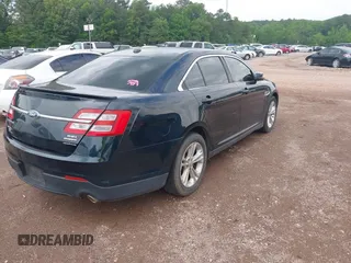 2014 Ford Taurus SEL with VIN 1FAHP2E83EG125068, listed as a IAAI auction lot 42101295 with 244,063 mi miles. Bid and sale history available at carsss.com. Image 4.