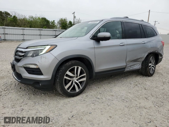 2017 Honda Pilot Touring z VIN 5FNYF6H92HB006855, wystawiony jako Copart lot #53650655 z przebiegiem 130 732 mil mil oraz Szkoda całkowita • Salvage title. Historia ofert i sprzedaży dostępna na DreamBid. Obrazek 1.