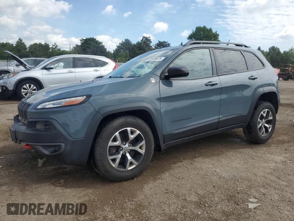 2015 Jeep Cherokee Trailhawk with VIN 1C4PJMBB1FW630715, listed as a Copart auction lot 58559675 with 58,302 mi miles and Salvage title. Bid and sale history available at DreamBid. Image 1.