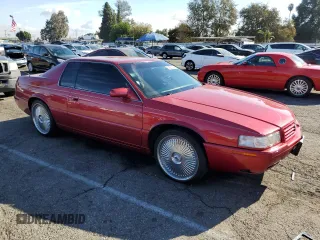 1999 Cadillac Eldorado Touring z VIN 1G6ET1293XU611368, wystawiony jako Copart lot #82683114 z przebiegiem 126 178 mil mil oraz Szkody całkowita. Historia ofert i sprzedaży dostępna na DreamBid. Obrazek 4.